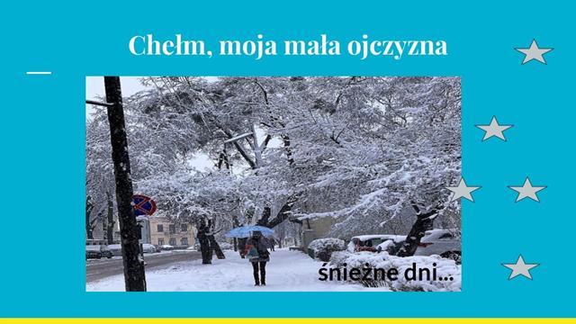 Zdjęcie przedstawiające chełmską ulicę w śnieżny dzień i napis: ,,Chełm, moja mała ojczyzna’’.